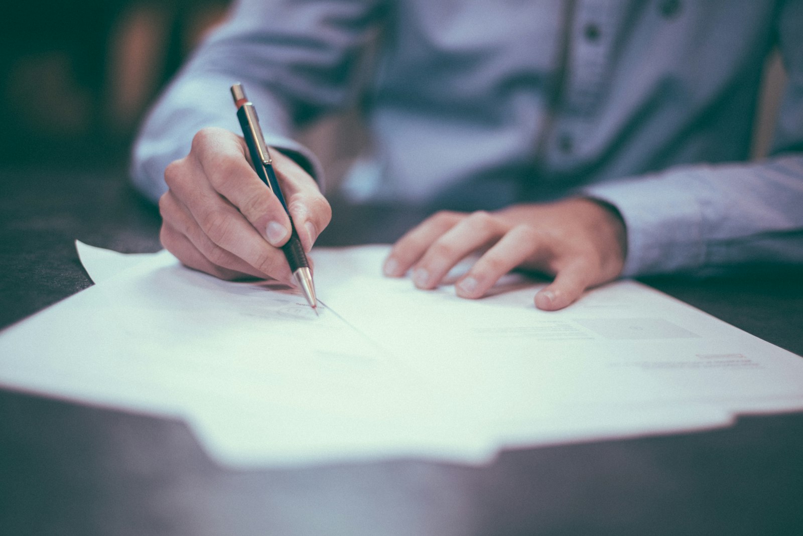 Professional reviewing business paperwork during a consultation